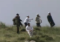 Settler violence in the presence of soldiers. B'Tselem video, April 2011