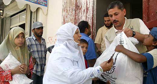 Food distribution in Gaza, 5 July 2006. Photo by Ibraheem Abu Mustafa, Gaza