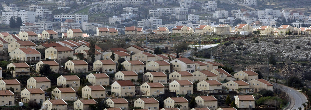 Photo: Houses in the settlement of Ofra, with the petitioning village of 'Ein Yabrud in the background / by Baz Ratner, Reuters