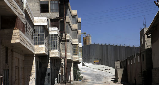 Abandoned buildings located near the Separation Barrier in the town of Bir Nabala, 24 September 2012. Photo: Anne Paq, activestills.org.