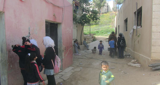 Children in yard outside the buildings where search was conducted. Background: Fence and buildings of settlement of Kiryat Arba. Photo: Manal al-Ja’abari, B’Tselem, 24 March 2015 Children in yard outside the buildings where search was conducted. Background: Fence and buildings of settlement of Kiryat Arba. Photo: Manal al-Ja’abari, B’Tselem, 24 March 2015