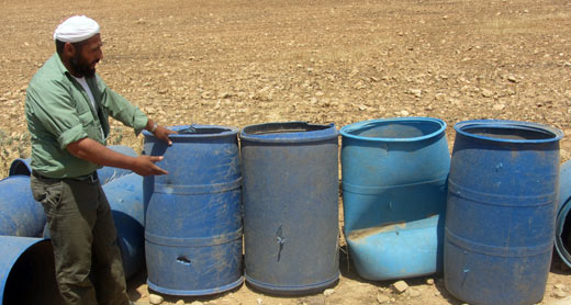 The residents discovered bullet holes in their water cisterns. Photo by 'Aref Daraghmeh, B'Tselem, 10 June 2015