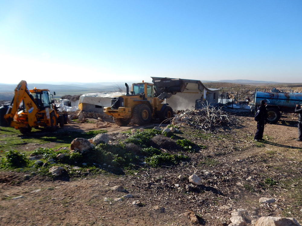 House demolition in Khirbet Jenbah. Photo: Nasser Nasser Nawaj'ah, B'Tselem, 2 Feb. 2016