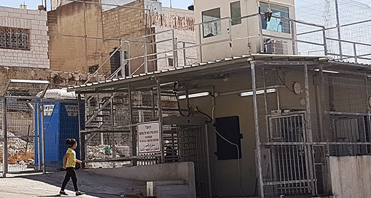Checkpoint 160. Separates the Tomb of the Patriarchs (al-Haram al-Ibrahimi) from the neighborhood to its south. Staffed around the clock. In September 2016, the checkpoint was expanded, with turnstiles and a security-check booth added. Palestinians aged 16-30 who are not residents of the area are denied passage. Photo by Iliana Mahamid, B’Tselem, 5 October 2016. Checkpoint 160. Separates the Tomb of the Patriarchs (al-Haram al-Ibrahimi) from the neighborhood to its south. Staffed around the clock. In September 2016, the checkpoint was expanded, with turnstiles and a security-check booth added. Palestinians aged 16-30 who are not residents of the area are denied passage. Photo by Iliana Mahamid, B’Tselem, 5 October 2016.