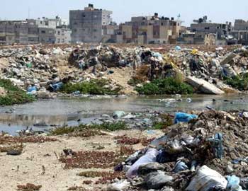 Wastewater flowing through the Rafah regional waste dump. Photo: Courtesy of EWASH. 