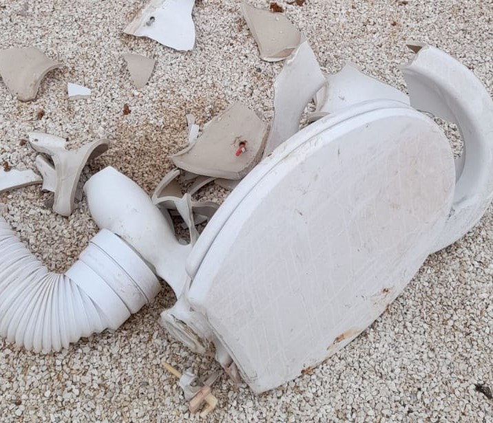 A toilet broken by settlers on Rajeh Jbarah’s land, Turmusaya, 27 Nov. 2020. Photo by Sai’d ‘Abdallah 