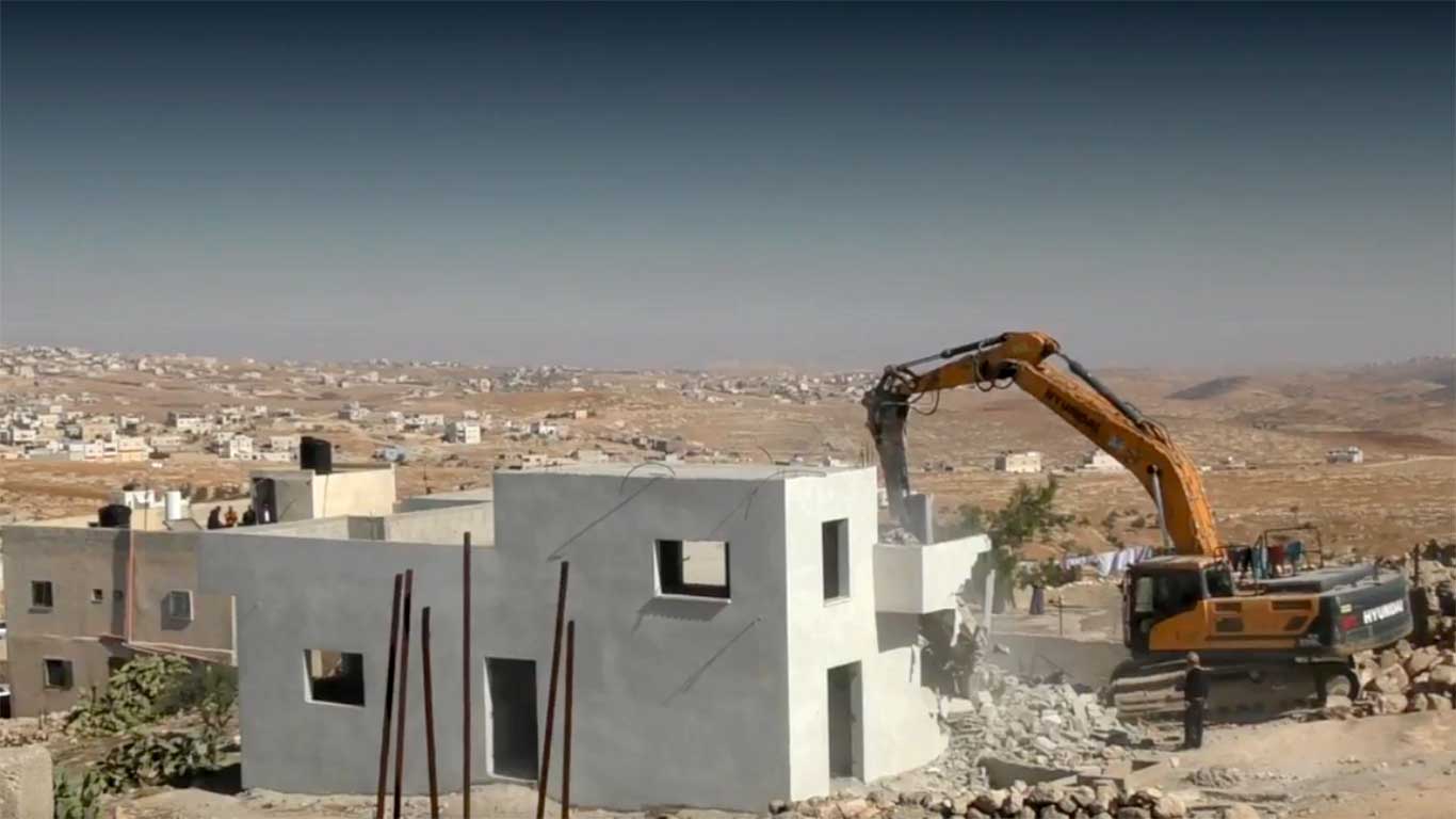 The demolition of the house in Khirbet Ma'in. Photo by Nasser Nawaj'ah, B'Tselem, 23 Nov. 2021