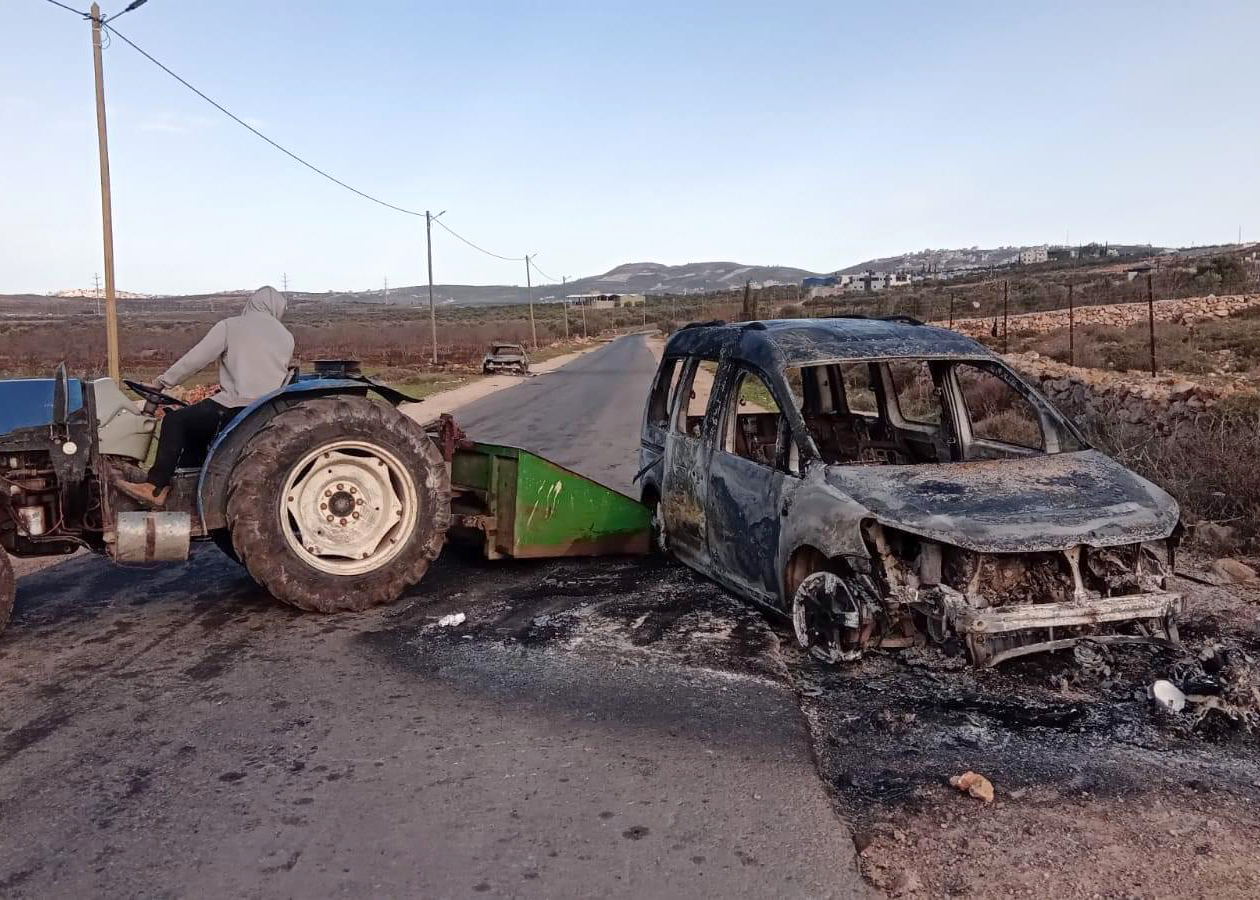 Two of the cars the settlers torched. Photo: Salma a-Deb'i, B'Tselem