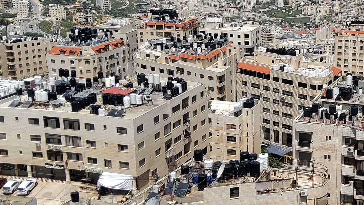 Water tanks on the roofs of residential buildings in the city of Nablus. Photo by Salma a-Deb'i, B'Tselem, 19 April 2023