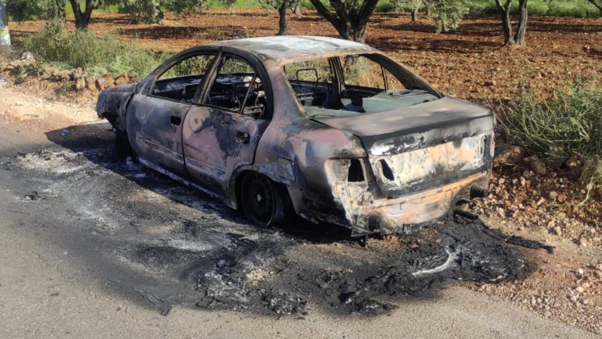 מכוניתו של תיים אבו עוואד ששרפו המתנחלים ב-11.5.23. צילום: איאד חדאד, בצלם, 16.5.23. 