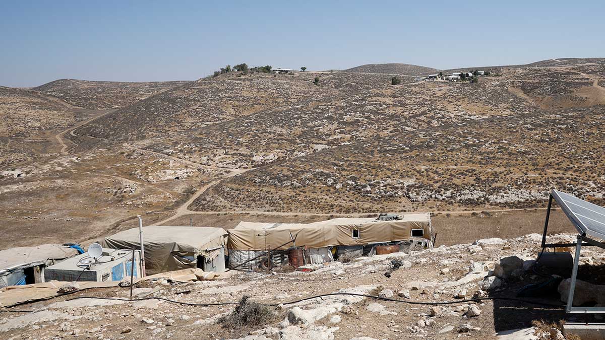 Structures in the community of Khirbet a-Rahwah. The Mor Farm and Avraham Farm outposts are seen in the background. Photo: Omri Eran Vardi