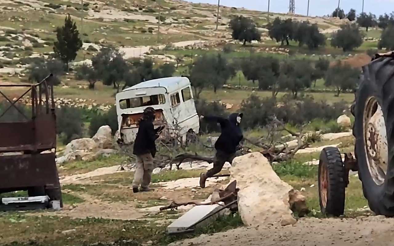 Teenage settlers attacking Naser Nawaj’ah’s house with stones. Photo courtesy of the family