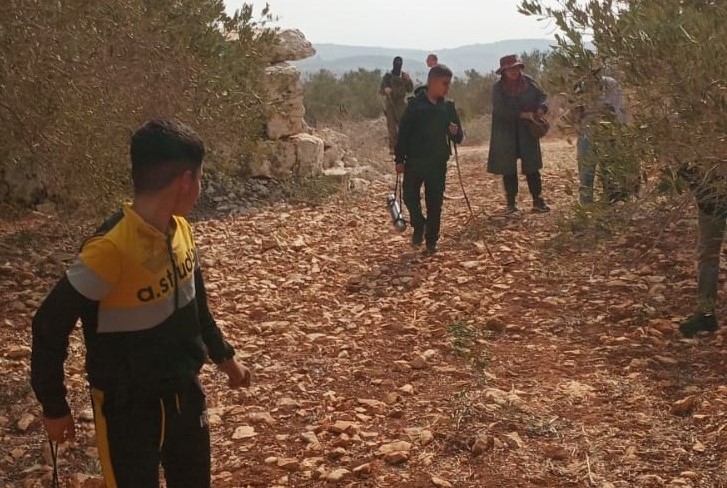 A masked soldier in the Abu Bakr family grove. Photo courtesy of the family