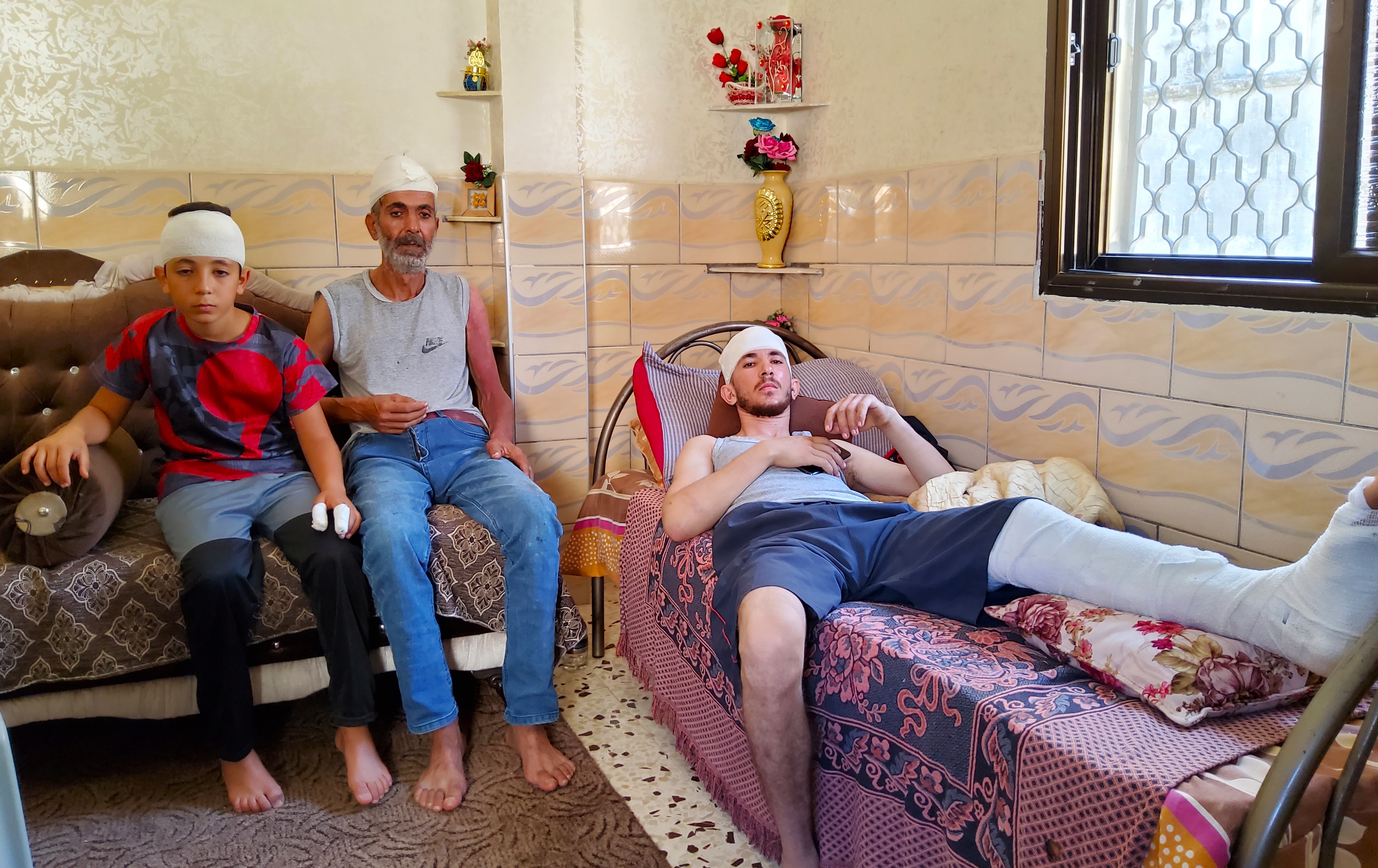 Nader Mahmoud As’ad (center) and his sons Mahmoud (right) and Zeid. Photo: Salma a-Deb’i, B’Tselem