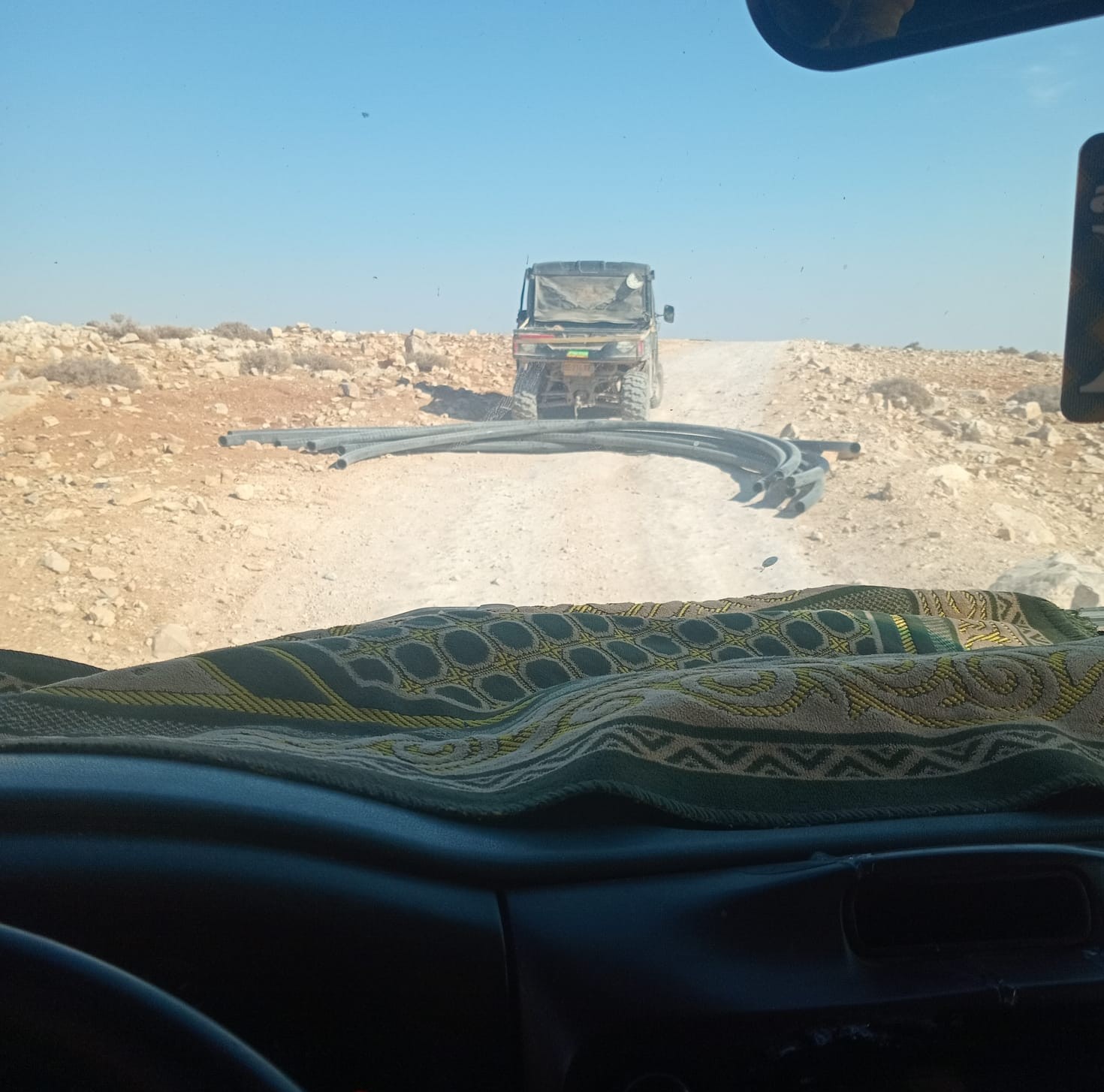 The settlers’ ATV towing the stolen pipes. Photo courtesy of local residents