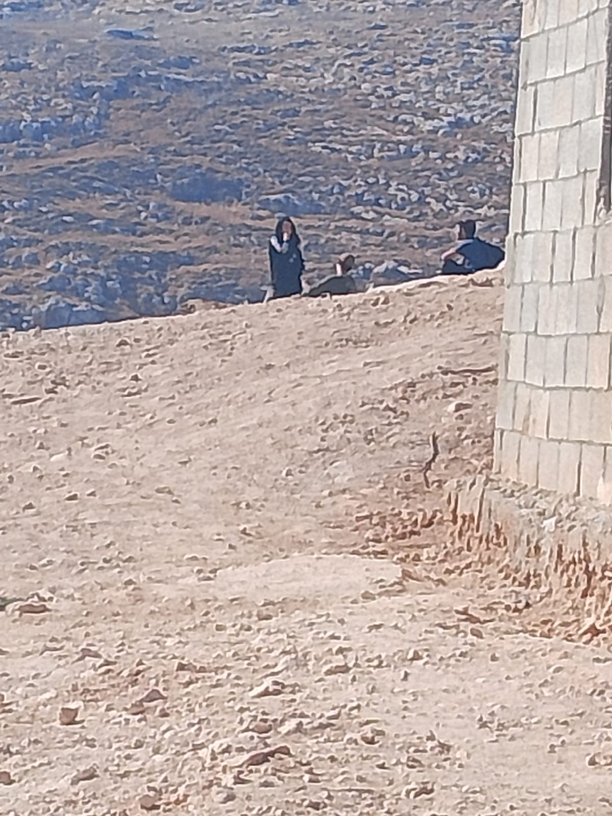Settlers near the family home. Photo courtesy of the family 