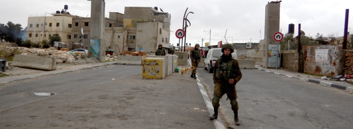 Soldiers next to the main entrance to Hizma blocked by the Israeli military. Photo by 'Amer 'Aruri, B'Tselem, 23 January 18