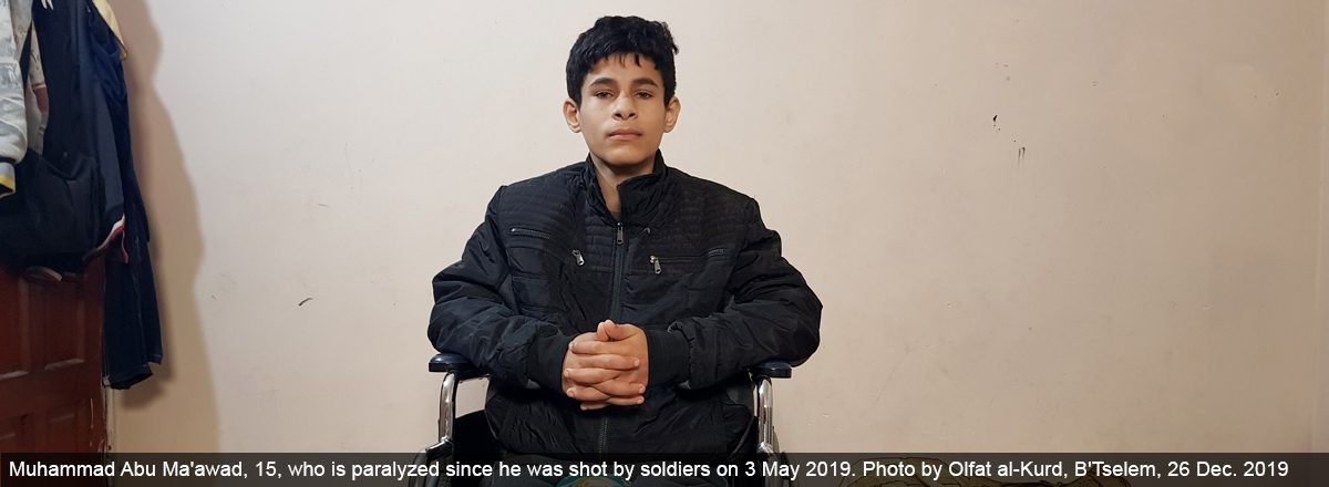 Muhammad Abu Ma'awad, 15, who is paralyzed since he was shot by soldiers on 3 May 2019. Photo by Olafat al-Kurd, B'Tselem, 26 Dec. 2019