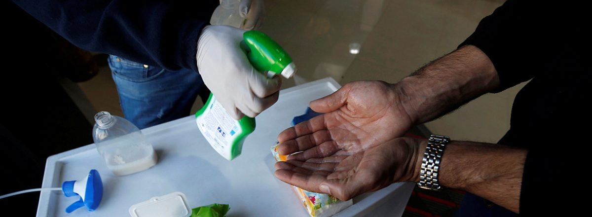Hand sanitizing in Gaza supermarket. Photo by Mohammed Salem, Reuters, 8 March 2020