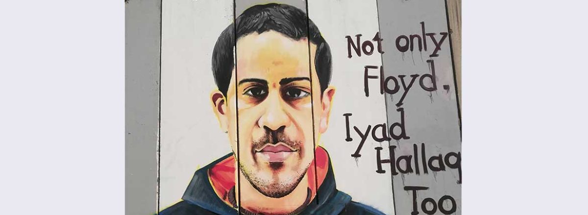 Portrait of Iyad al-Halaq on the separation barrier in Bethlehem. Photo:  Amin Ramal