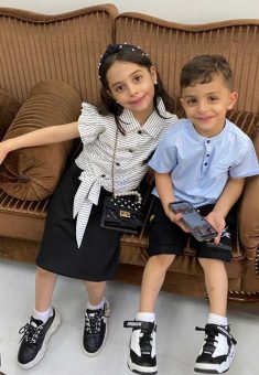‘Omar Abu Kweik befored he was injured, with his sister Yasmin who was killed in the bombing. Photo courtesy of the family 