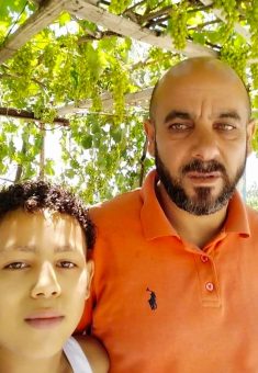 Almaza a-Sultan’s husband Ziad and their son Bilal in their yard, before their home was destroyed. Photo courtesy of a-Sultan 