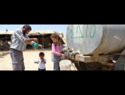 Village of a-Duqaiqah, South Hebron Hills, not hooked up to water grid; villagers purchase water from water-trucks, paying 4 times as much as the average water tariff for private use in Israel. Photo by Nasser Nawaj'ah, B’Tselem, 19 August 2012
