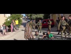 The Abu Shamsiyehs block the road to protest the detention of two of their sons, Tel Rumeidah, Hebron, 10 May 2019