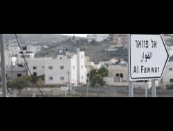  הכניסה למחנה הפליטים אל-פוואר. צילום: מוסא קוואסמה, רויטרס, 25.11.15