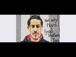 דיוקנו של איאד אל-חאק על גדר ההפרדה בבית לחם. צילום: אמין רמאל