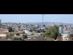 A watchtower erected by the military at one of the entrances to the town of Silwad. Photo by Iyad Hadad, B’Tselem, 27 Aug. 2016