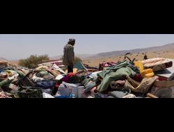 A resident of Khirbet Homsa al-Fuqa stands amidst the community's property, dumped by Israeli forces near 'Ein a-Shibli. Photo by Oren Ziv, ActiveStills, 7 July 2021