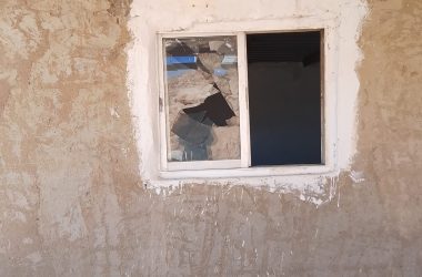 A window smashed by settlers in the family’s home. Photo courtesy of the family