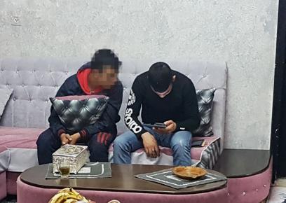 H.R. (on the left) at home with a friend. Photo by Amit Gilutz, B'Tselem, 24 Dec. 2017