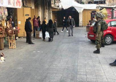 The soldiers standing in front of the shops. Photo by CPT