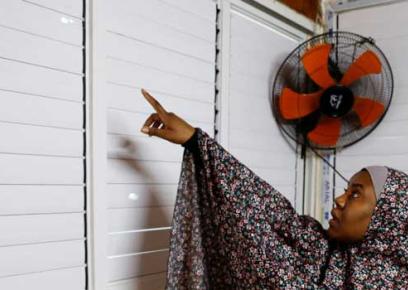 Kifaya ’Abeid, Majedah ’Abeid's daughter, pointing to a bullet hole in the window. Photo by: Raneen Sawafta, Reuters, 26 Jan. 2023