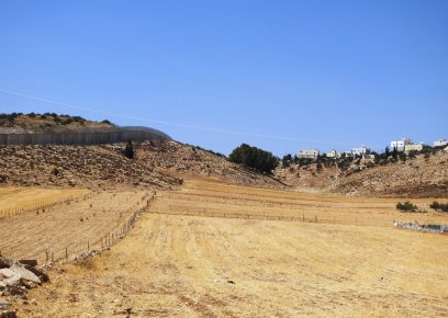 The Separation Barrier next to the village of Deir al-’Asal al-Foqa. Photo courtesy of residentnurs