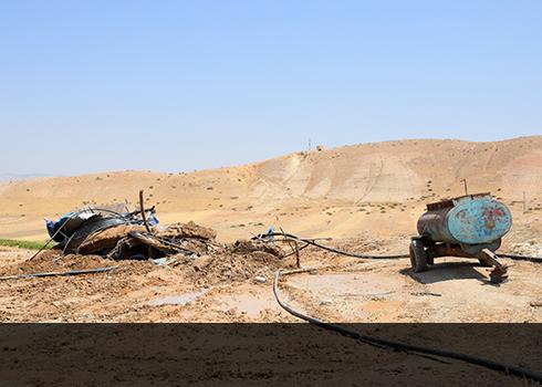 Remains of demolished drinking-water tank, Khallet al-Khader. Photo by ‘Aref Daraghmeh, B’Tselem, 4 July 2018