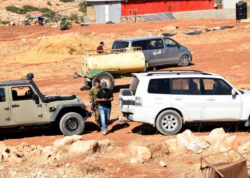 Military and Civil Administration personnel in the community on Thursday. Photo: ‘Aref Daraghmeh, B'Tselem, 12 August 2018