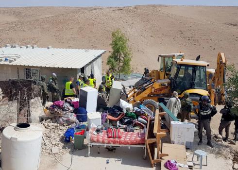 Personnel and bulldozers near one of the structures before the demolition. Photo by Nasser Nawaj'ah, B’Tselem, 9 October 2018.