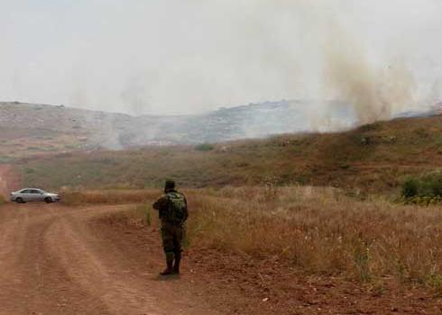 Israeli soldier watching blaze near Khirbet al-Malih, the Jordan Valley. Photo by ‘Aref Daraghmeh, B’Tselem, 6 May 2019 Israeli soldier watching blaze near Khirbet al-Malih, the Jordan Valley. Photo by ‘Aref Daraghmeh, B’Tselem, 6 May 2019