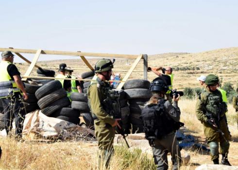 The force dismantling the sheep pen this morning. Photo by Nasser Nawaj'ah, B'Tselem, 16 May 2019