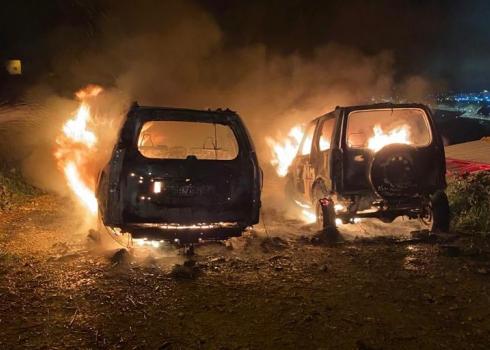 Hamad Krishan's cars on fire after being torched by settlers. Beit Iksa, 19 March 2021. Photo by Hamad Krishan