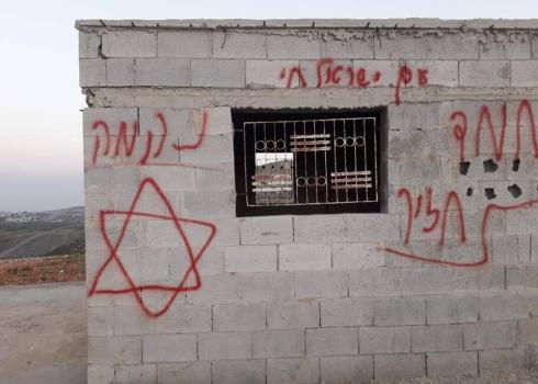 Slogans spray-painted by setters on the walls of the agricultural structure