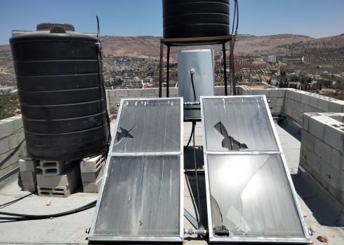 Smashed solar panels on the roof of the Soufan family home. Photo by Salma a-Deb’i, B’Tselem, 12 July 2021.