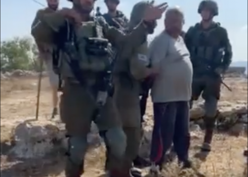 Soldiers arresting Najib Masalmeh for allegedly assaulting a settler. Photo courtesy of the shepherds (still photo from video footage)