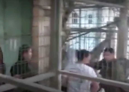 A soldier turning the teens back at Bab a-Zawiya Checkpoint. Photo: Human Rights Defenders 