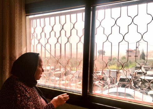 Insherah Khmous and the burnt scrap yard. Photo by Salma a-Deb’i, B'Tselem, 13 March 2023