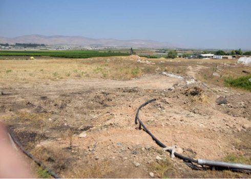 Burnt bales of hay that had been covered in dirt to stop the fire from spreading. Photo: 'Aref Daraghmeh, B’Tselem, 5 June 2023 
