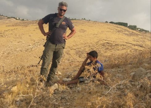 Avihai Shorshan, Kfar Adumim settlement security chief, terrorizes 11-year-old ‘Iz a-Din Jahalin from of the  Khan al-Ahmar community who had gone to collect sheep. Photo courtesy of residents. 